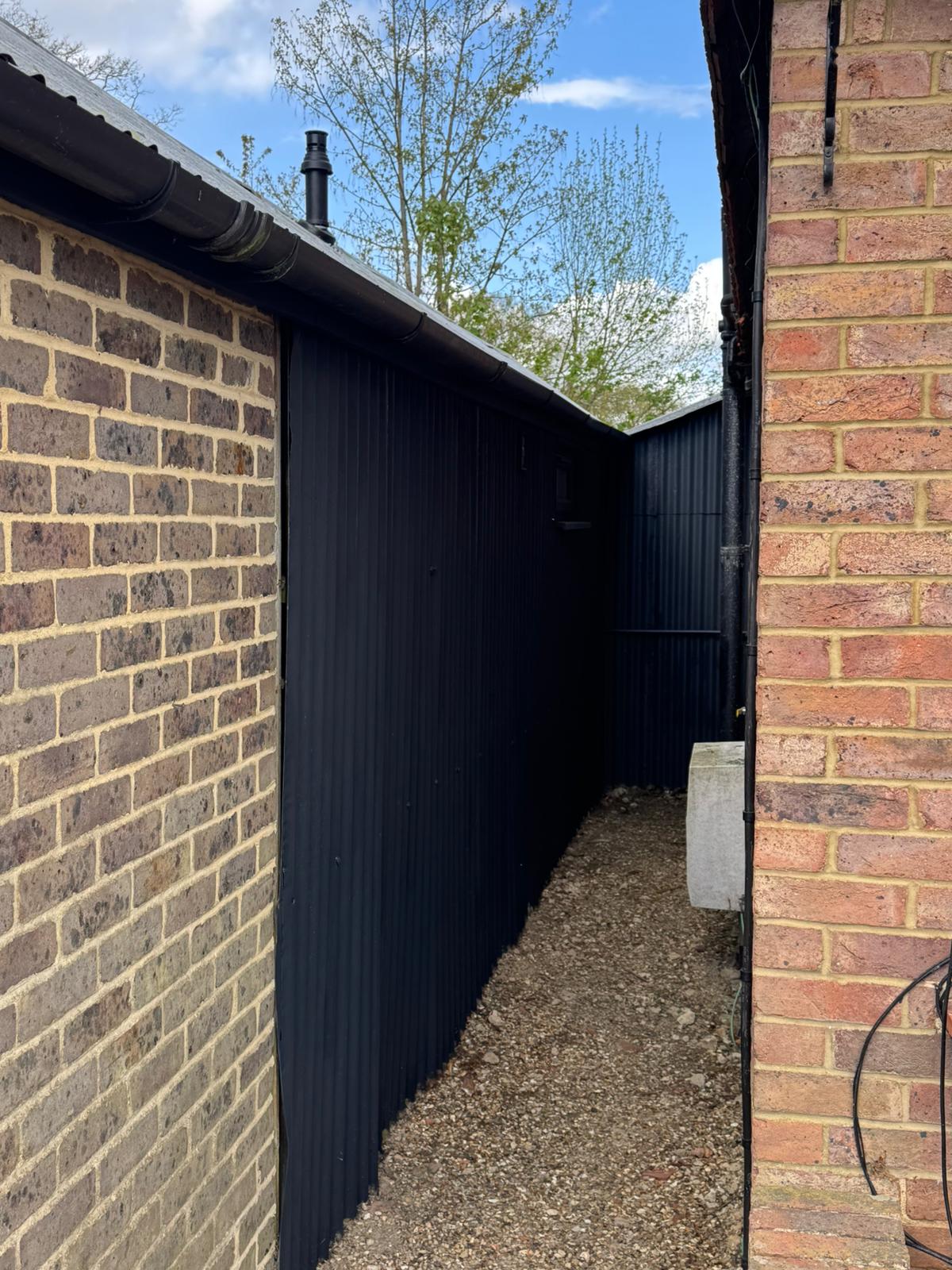 Outbuilding exterior repaint - After